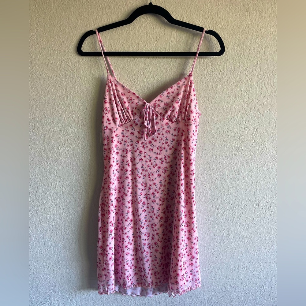 Tilly’s dress size medium but fits more like small length wise. Has rose pattern